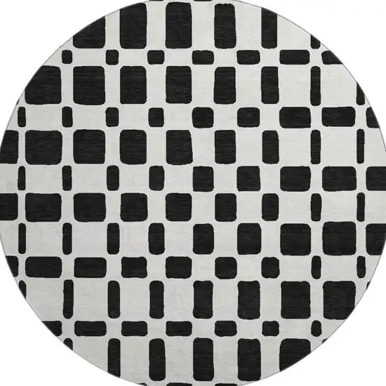 8' Black And Ivory Geometric Washable Round Rug With UV Protection Photo 4