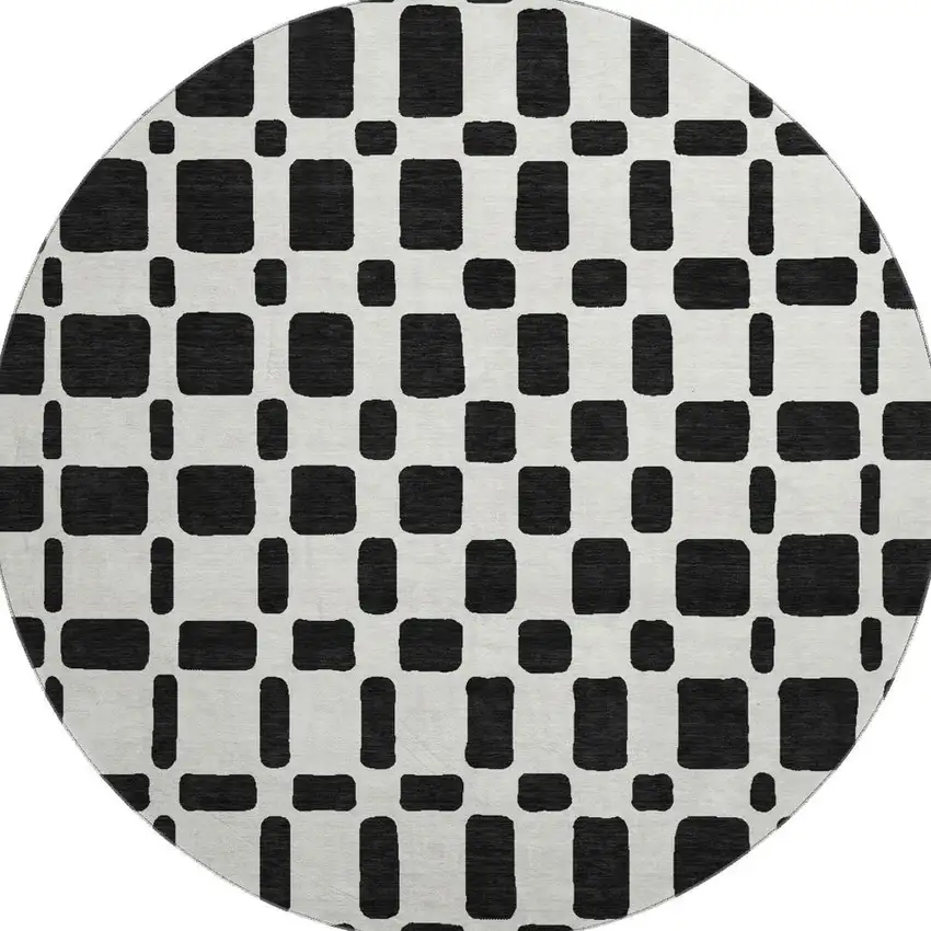 8' Black And Ivory Geometric Washable Round Rug With UV Protection Photo 4