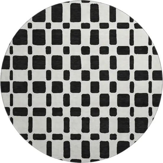 8' Black And Ivory Geometric Washable Round Rug With UV Protection Photo 1