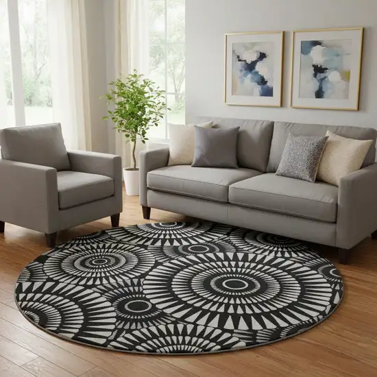 8' Black And Ivory Geometric Washable Round Rug With UV Protection Photo 1