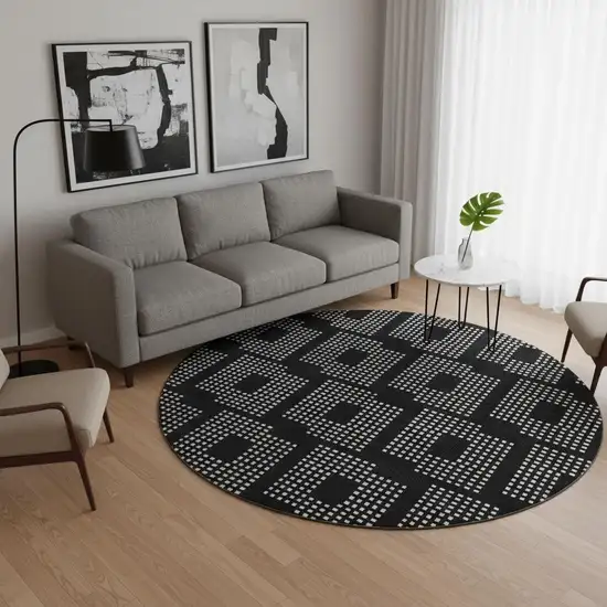 8' Black And Ivory Geometric Washable Round Rug With UV Protection Photo 2
