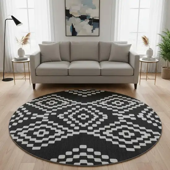 8' Black And Ivory Geometric Washable Round Rug With UV Protection Photo 2