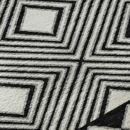 8' Black And Ivory Geometric Washable Round Rug With UV Protection Photo 9