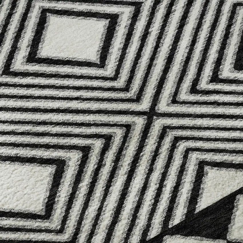 8' Black And Ivory Geometric Washable Round Rug With UV Protection Photo 9