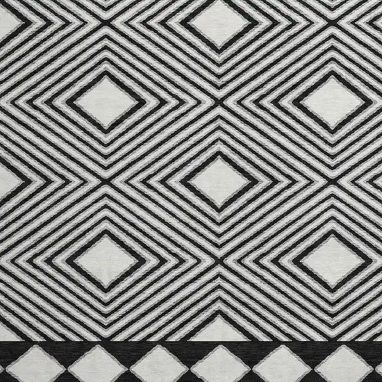 8' Black And Ivory Geometric Washable Round Rug With UV Protection Photo 3