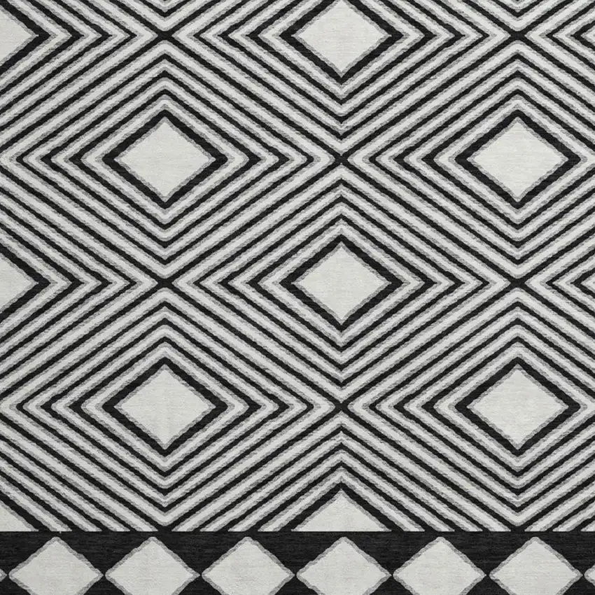 8' Black And Ivory Geometric Washable Round Rug With UV Protection Photo 3