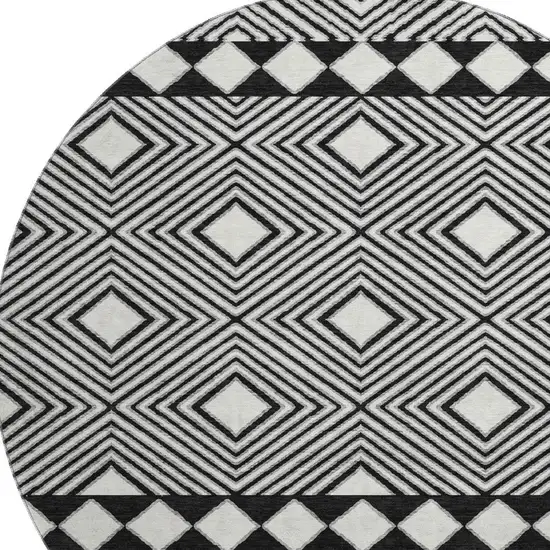 8' Black And Ivory Geometric Washable Round Rug With UV Protection Photo 4