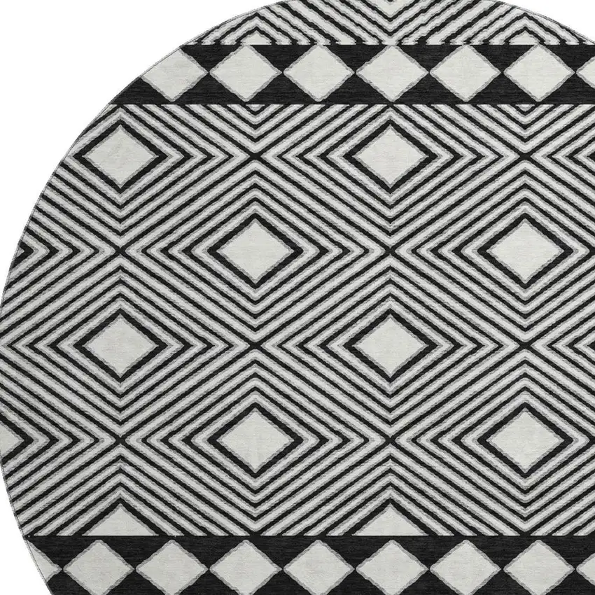 8' Black And Ivory Geometric Washable Round Rug With UV Protection Photo 4