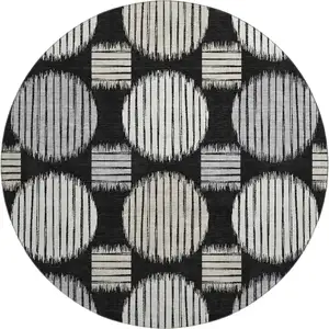 Photo of 8' Black And Ivory Geometric Washable Round Rug With UV Protection