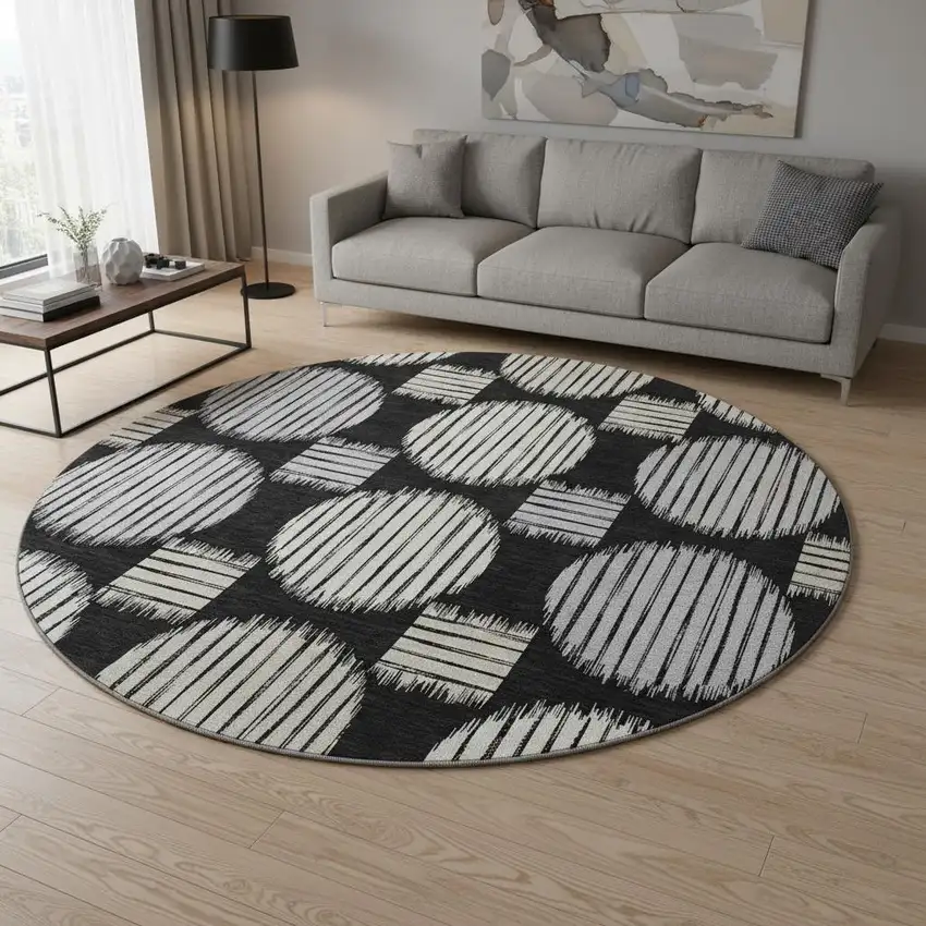 8' Black And Ivory Geometric Washable Round Rug With UV Protection Photo 2