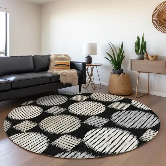 8' Black And Ivory Geometric Washable Round Rug With UV Protection Photo 4
