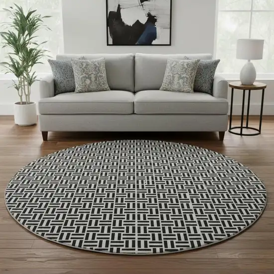 8' Black And Ivory Geometric Washable Round Rug With UV Protection Photo 2