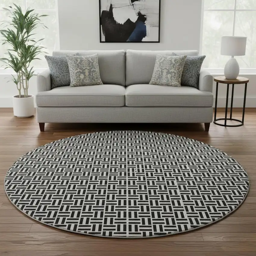 8' Black And Ivory Geometric Washable Round Rug With UV Protection Photo 2