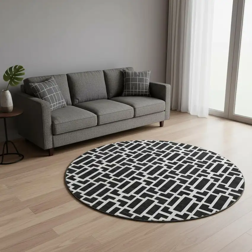 8' Black And Ivory Geometric Washable Round Rug With UV Protection Photo 2