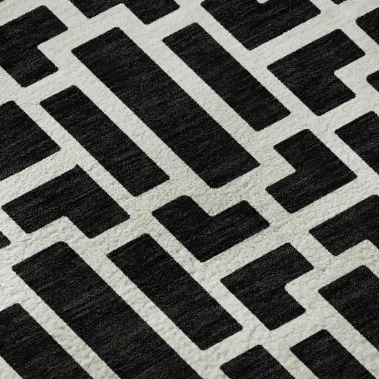 8' Black And Ivory Geometric Washable Round Rug With UV Protection Photo 9