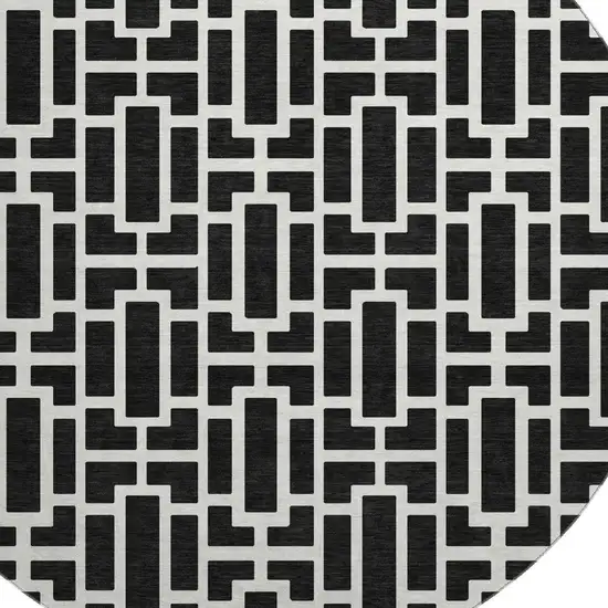 8' Black And Ivory Geometric Washable Round Rug With UV Protection Photo 3