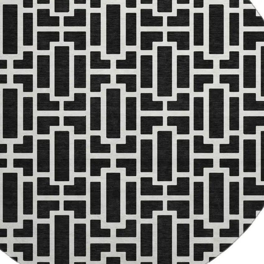 8' Black And Ivory Geometric Washable Round Rug With UV Protection Photo 3