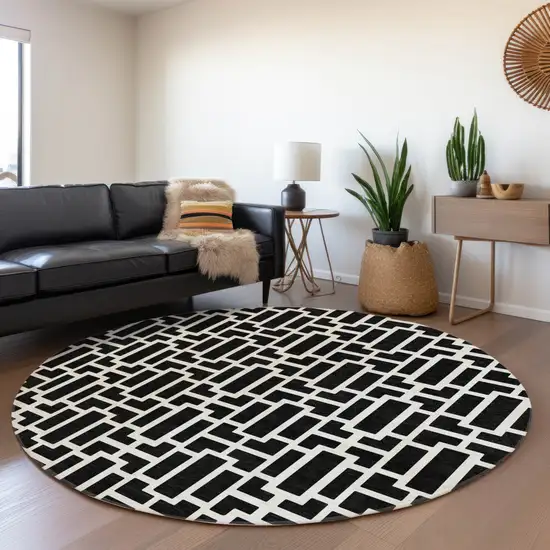 8' Black And Ivory Geometric Washable Round Rug With UV Protection Photo 5