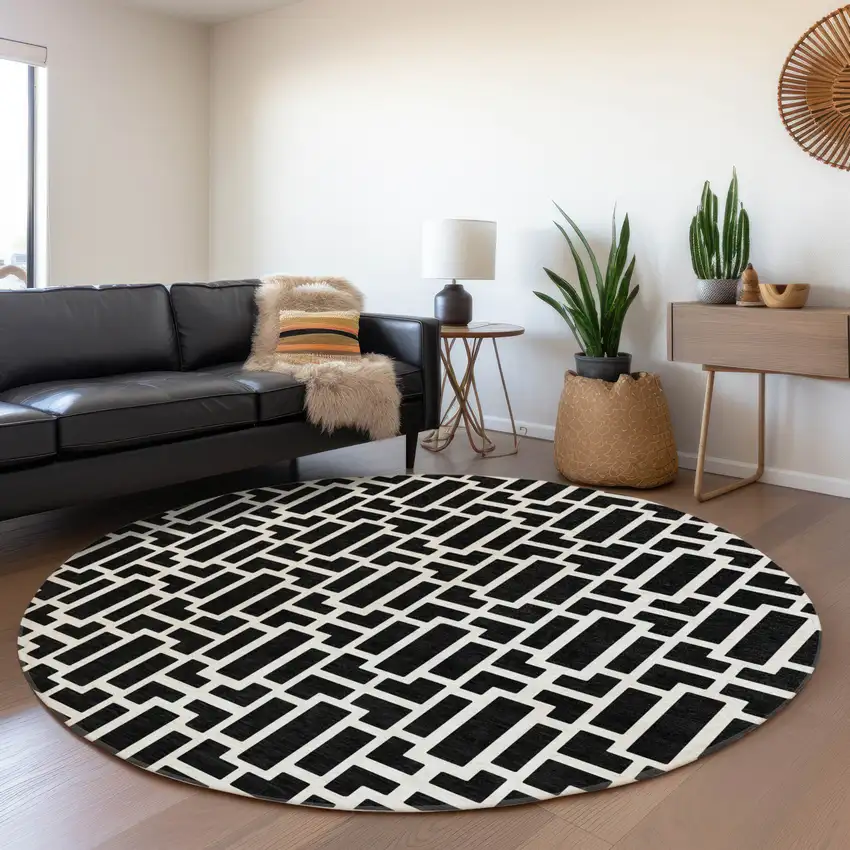 8' Black And Ivory Geometric Washable Round Rug With UV Protection Photo 5