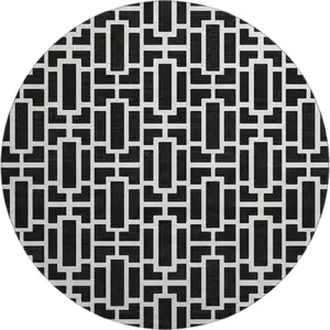 Photo of 8' Black And Ivory Geometric Washable Round Rug With UV Protection
