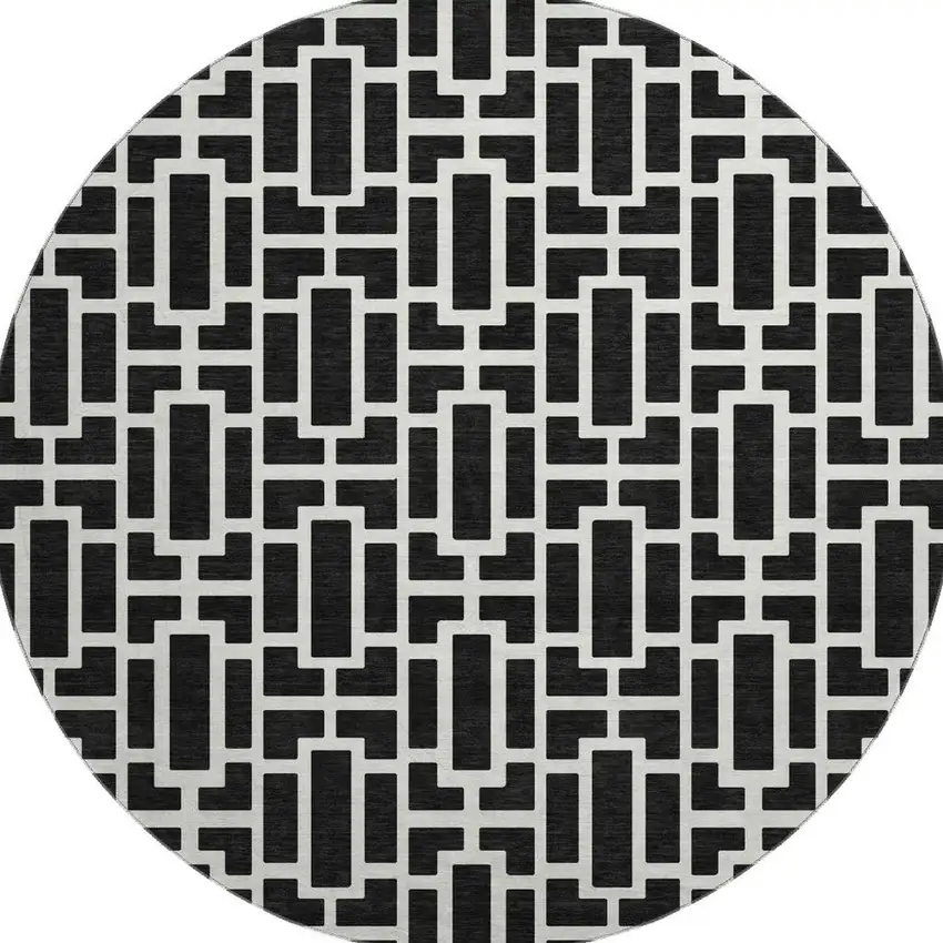 8' Black And Ivory Geometric Washable Round Rug With UV Protection Photo 4