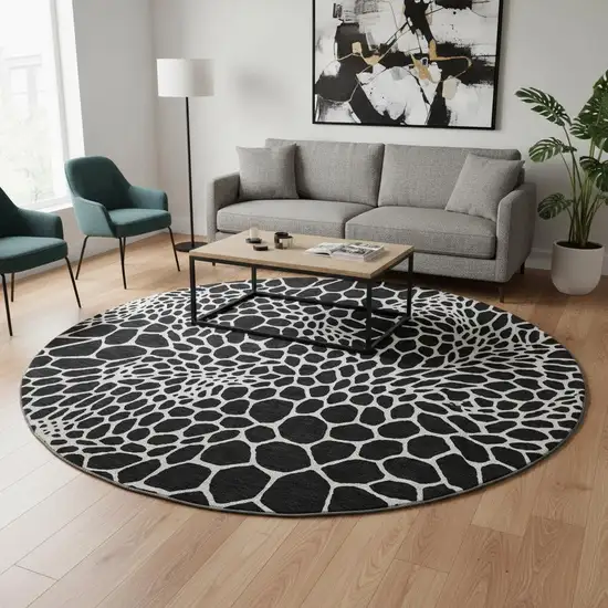 8' Black And Ivory Geometric Washable Round Rug With UV Protection Photo 2