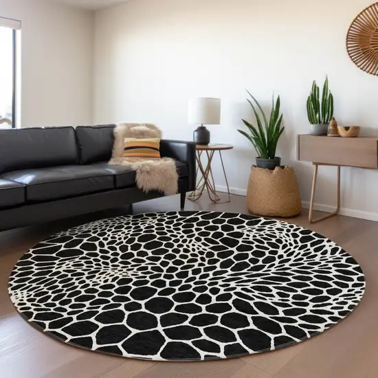 8' Black And Ivory Geometric Washable Round Rug With UV Protection Photo 5