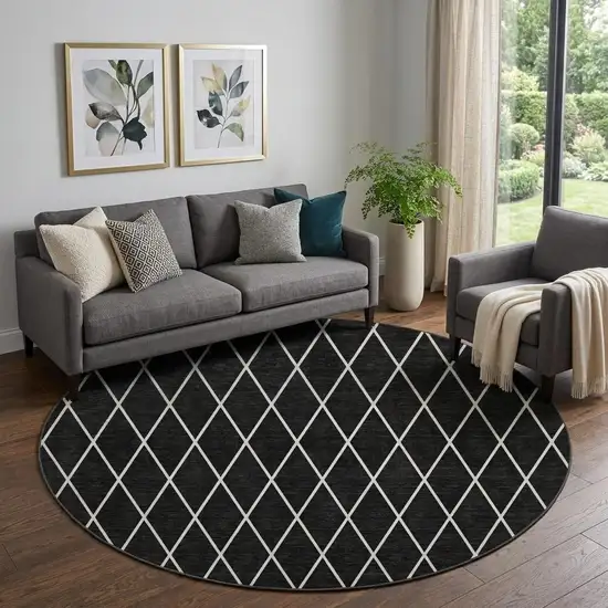 8' Black And Ivory Geometric Washable Round Rug With UV Protection Photo 1