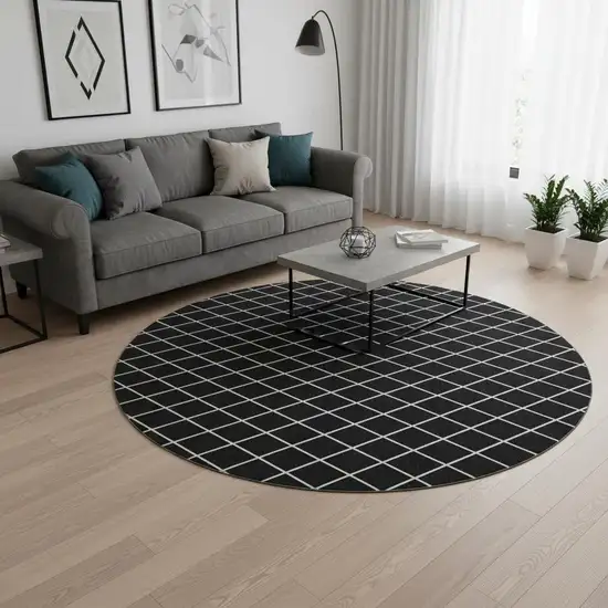 8' Black And Ivory Geometric Washable Round Rug With UV Protection Photo 2