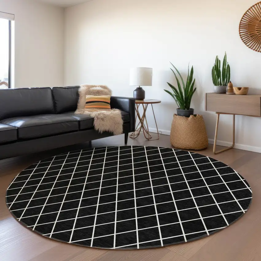 8' Black And Ivory Geometric Washable Round Rug With UV Protection Photo 4