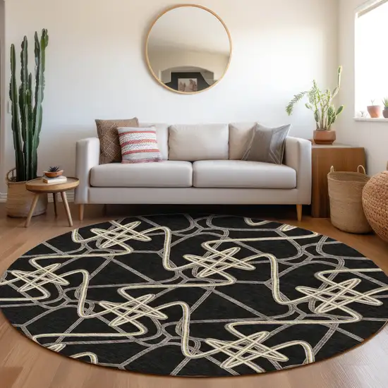 8' Black And Ivory Geometric Washable Round Rug With UV Protection Photo 4