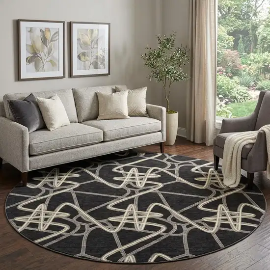 8' Black And Ivory Geometric Washable Round Rug With UV Protection Photo 1