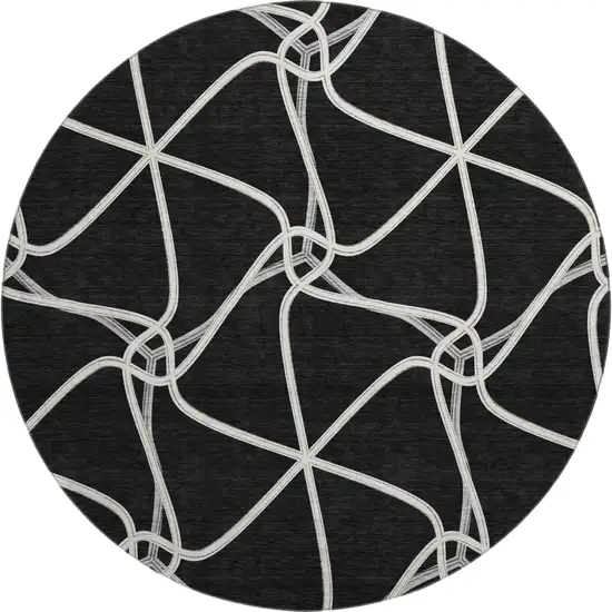 8' Black And Ivory Geometric Washable Round Rug With UV Protection Photo 1