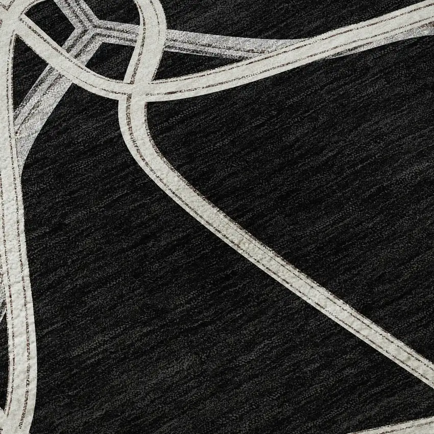 8' Black And Ivory Geometric Washable Round Rug With UV Protection Photo 8