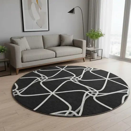 8' Black And Ivory Geometric Washable Round Rug With UV Protection Photo 2