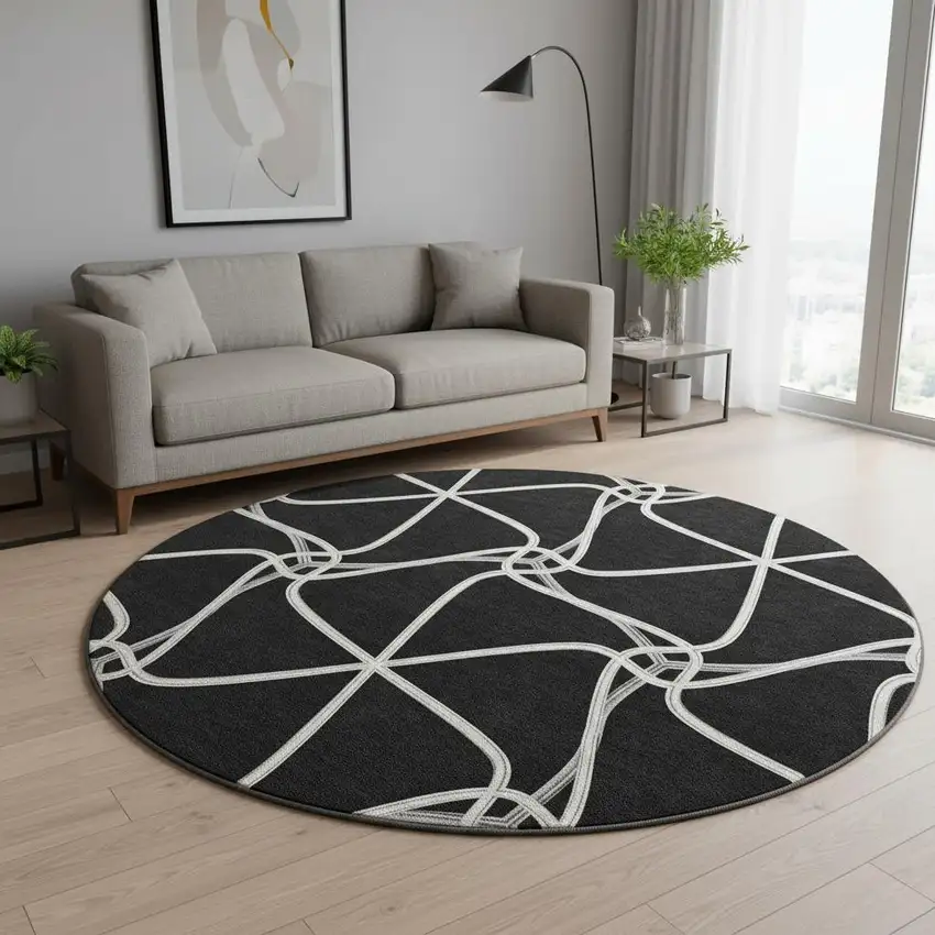 8' Black And Ivory Geometric Washable Round Rug With UV Protection Photo 2