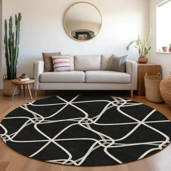 8' Black And Ivory Geometric Washable Round Rug With UV Protection Photo 4