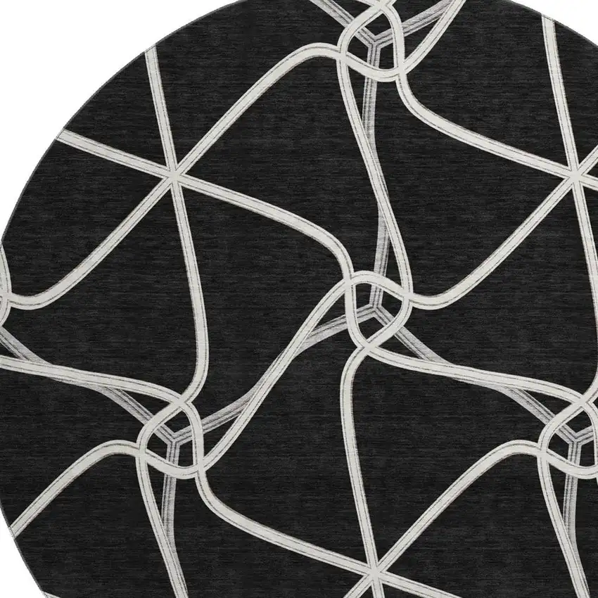 8' Black And Ivory Geometric Washable Round Rug With UV Protection Photo 2