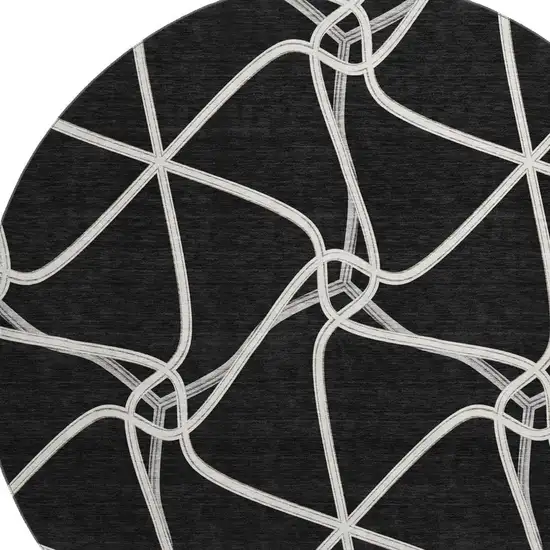 8' Black And Ivory Geometric Washable Round Rug With UV Protection Photo 2