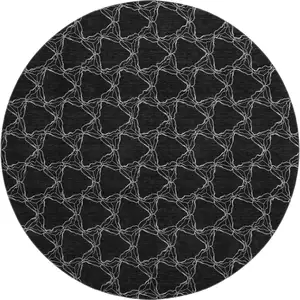 Photo of 8' Black And Ivory Geometric Washable Round Rug With UV Protection
