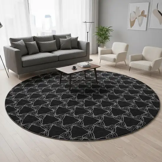 8' Black And Ivory Geometric Washable Round Rug With UV Protection Photo 2