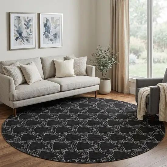 8' Black And Ivory Geometric Washable Round Rug With UV Protection Photo 1