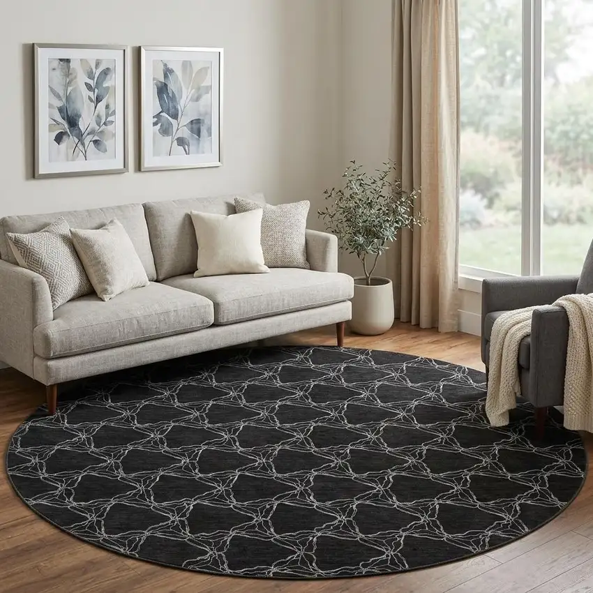 8' Black And Ivory Geometric Washable Round Rug With UV Protection Photo 1