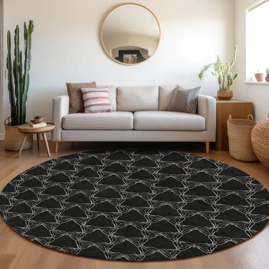8' Black And Ivory Geometric Washable Round Rug With UV Protection Photo 4