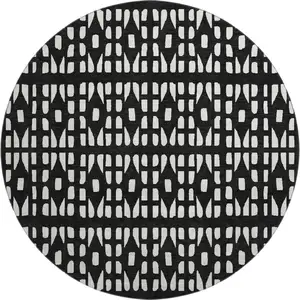 Photo of 8' Black And Ivory Geometric Washable Round Rug With UV Protection