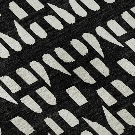8' Black And Ivory Geometric Washable Round Rug With UV Protection Photo 8