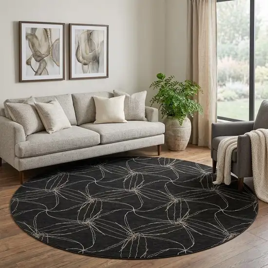 8' Black And Ivory Geometric Washable Round Rug With UV Protection Photo 1