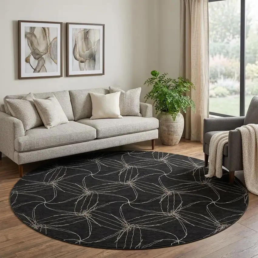 8' Black And Ivory Geometric Washable Round Rug With UV Protection Photo 1