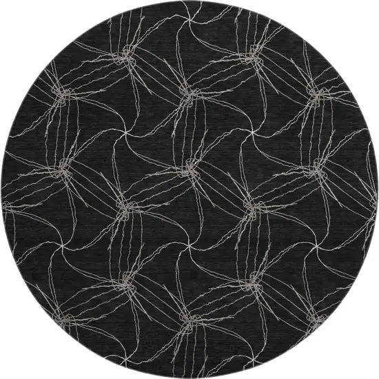 8' Black And Ivory Geometric Washable Round Rug With UV Protection Photo 1
