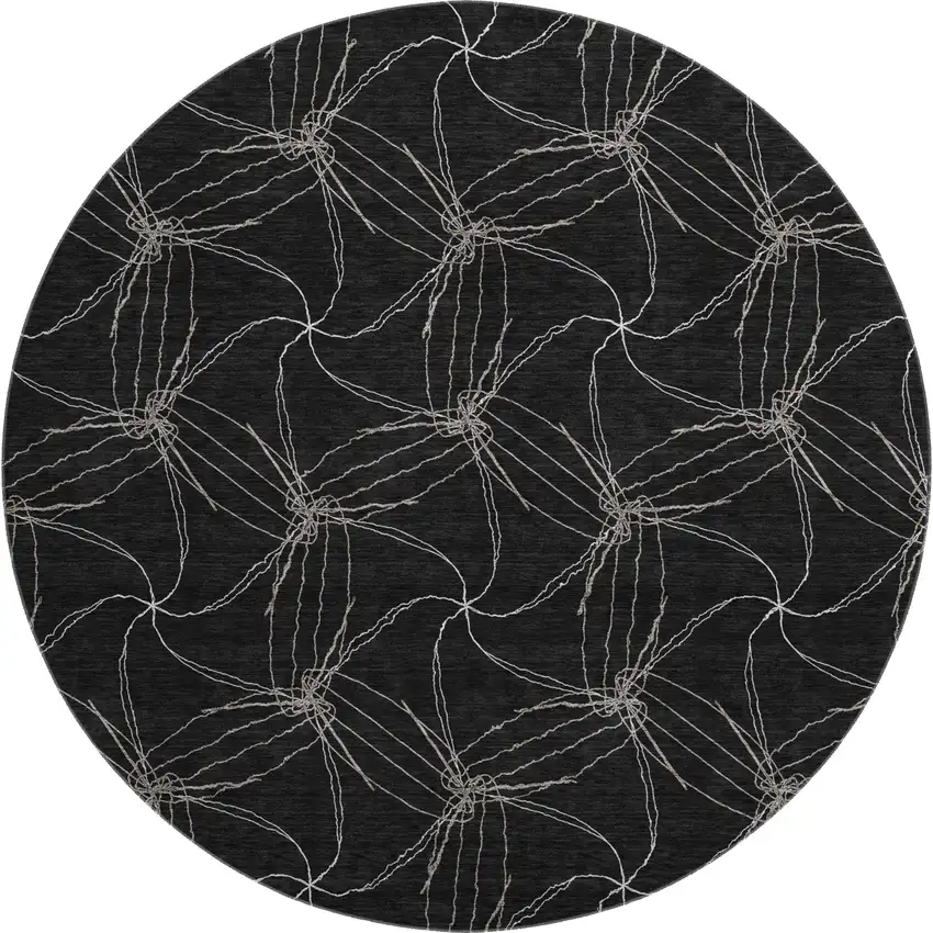 8' Black And Ivory Geometric Washable Round Rug With UV Protection Photo 1